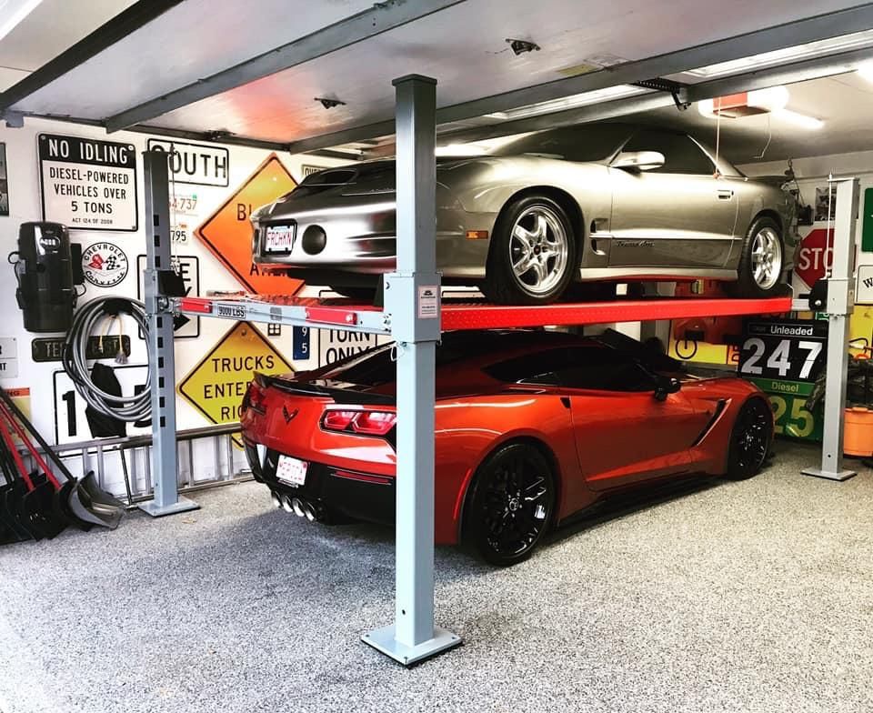 High angle view of car on auto lift.